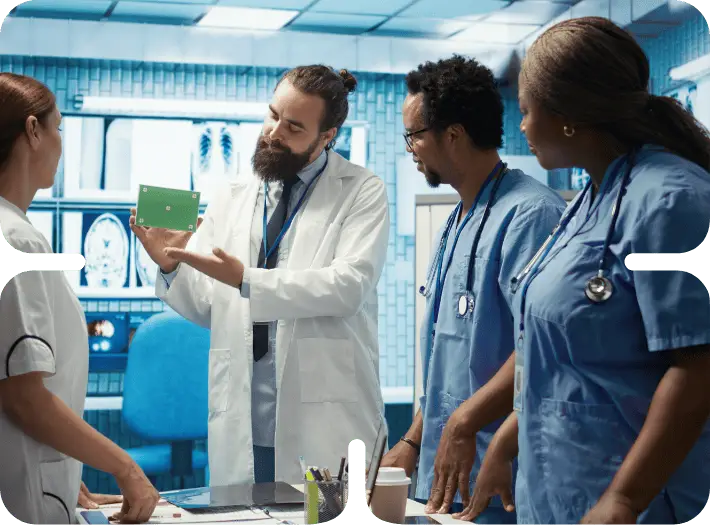 Medical professionals discussing a presentation.